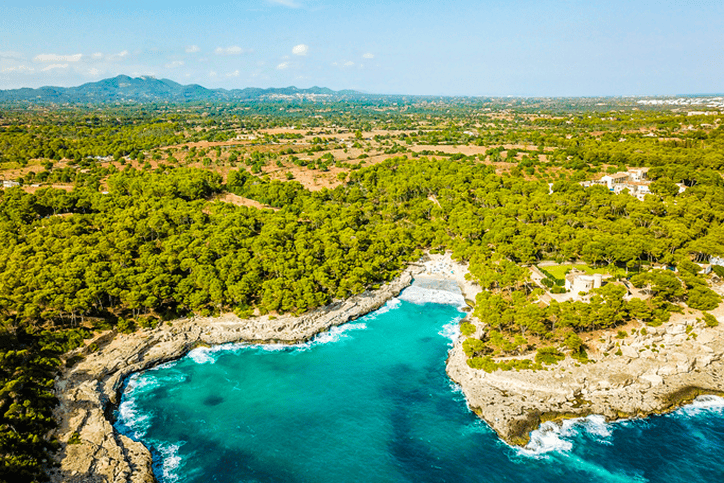 Aerial view of turquoise cove and coastline