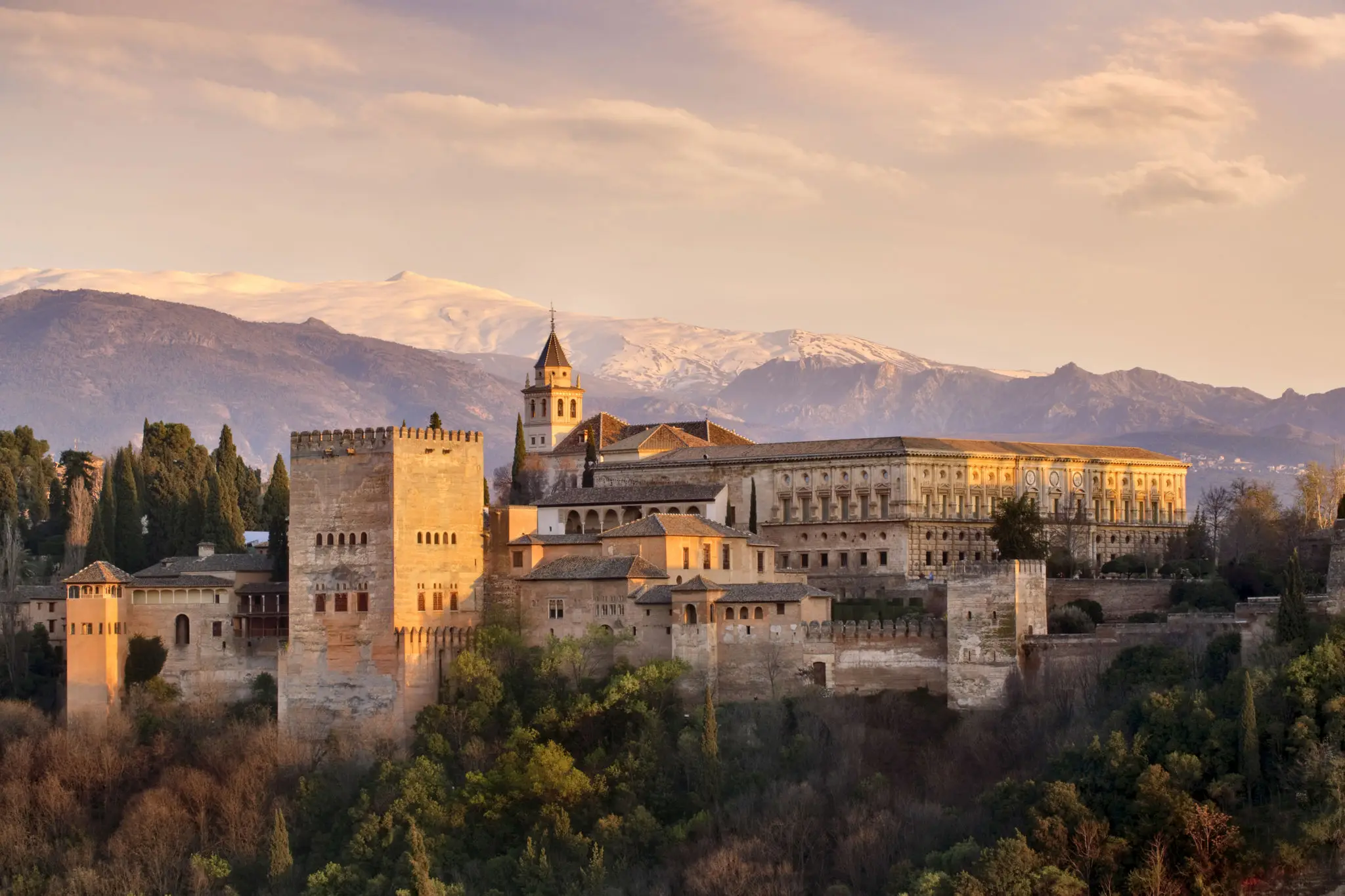 Alhambra palace in Granada with mountain backdrop
