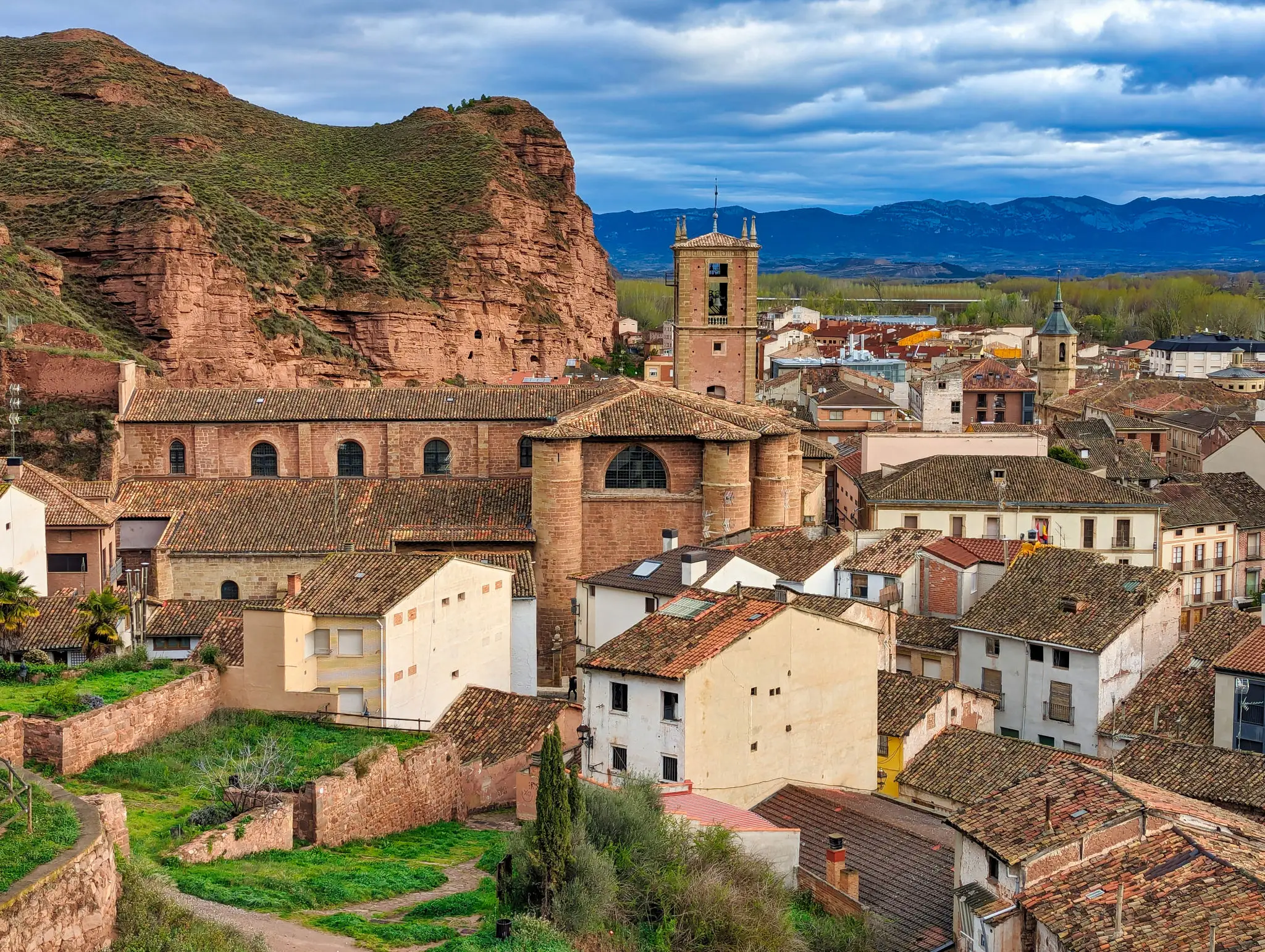 Historic village with church and rocky cliffs