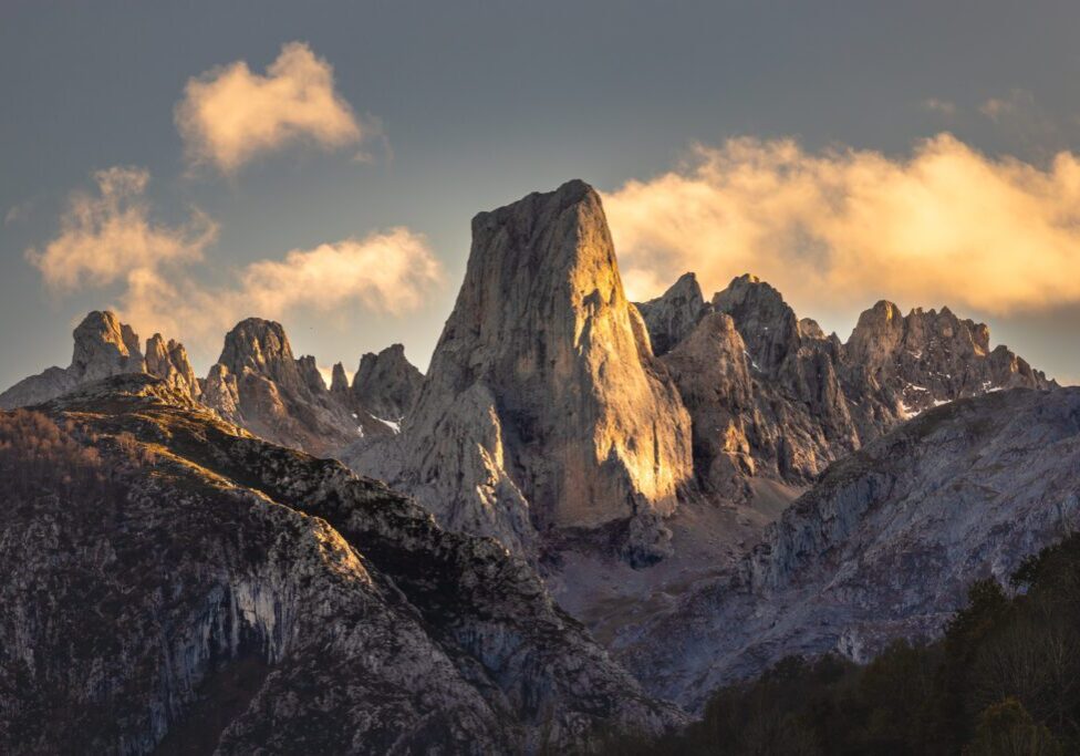 Sunlit jagged mountain peaks at sunset