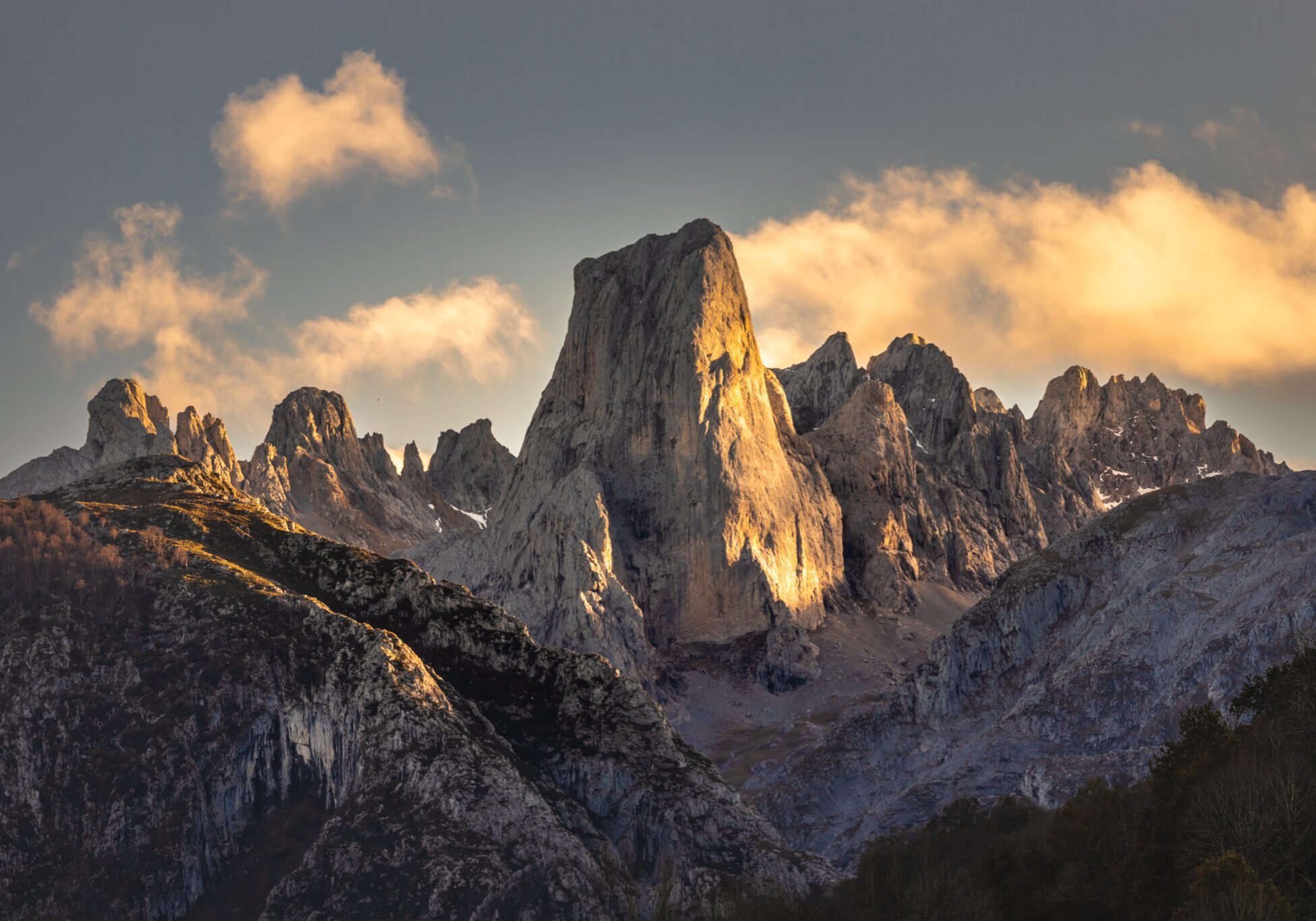 Sunlit jagged mountain peaks at sunset