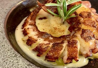 Grilled octopus tentacle with creamy puree, rosemary